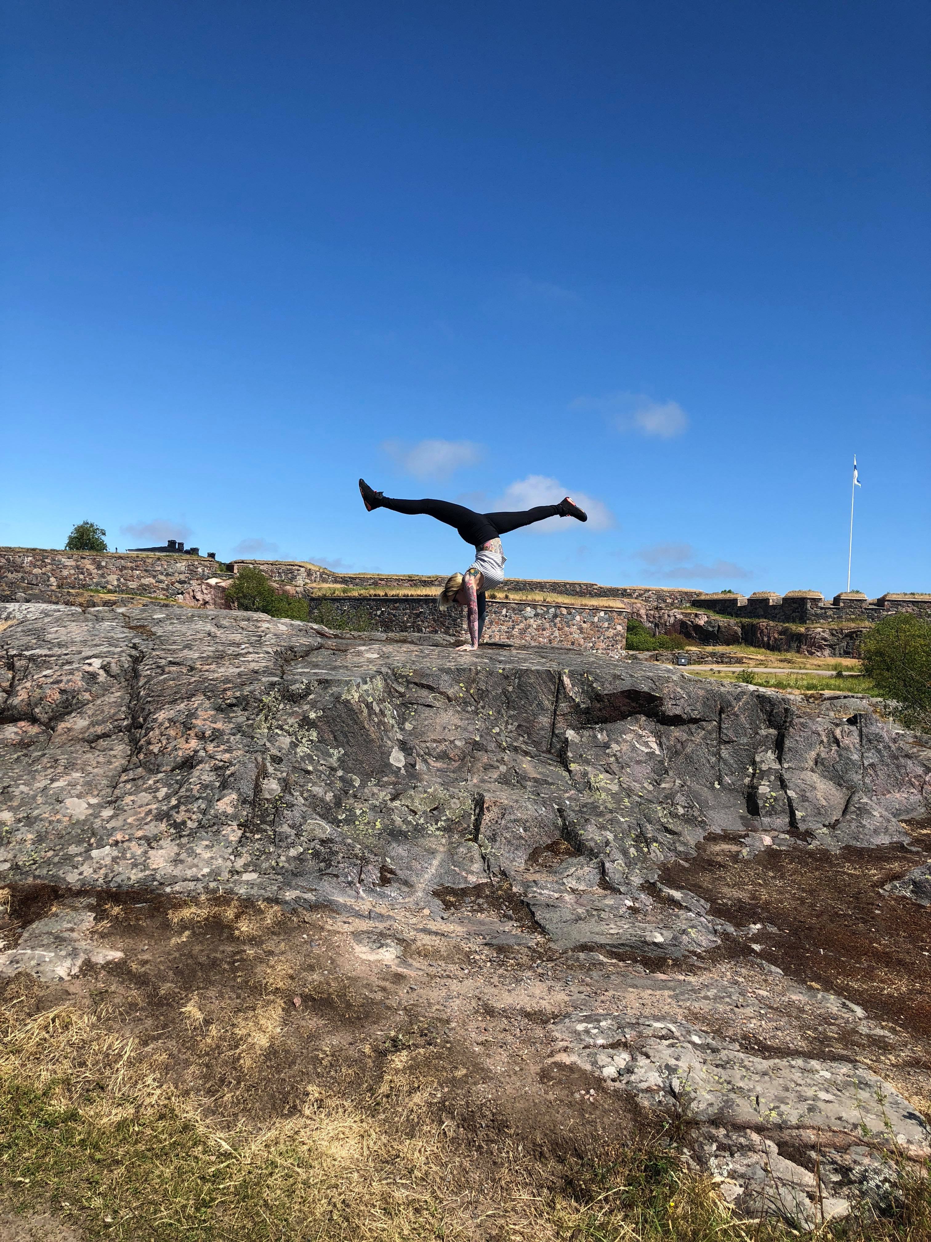 Lucky Hell doing a handstand on the walls of Suomenlinna Fortress, Helsinki